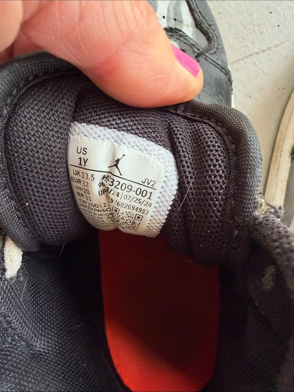 Nike Kids Black and White High-Top Sneakers with Orange Logo